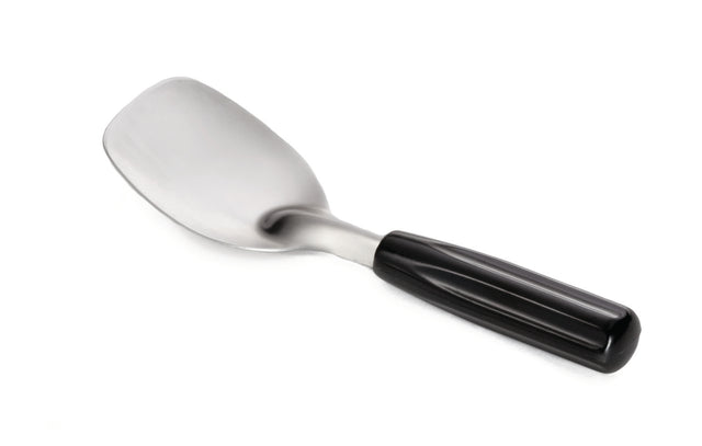 A stainless steel ice cream spade with a wide, slightly curved blade and a glossy black Bakelite handle, isolated on a white background. The utensil appears sturdy and is positioned diagonally, with the blade at the top left and the handle at the bottom right.