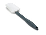 A white silicone spatula with a long, dark gray handle is shown against a white background. The high heat resistant blade is slightly angled, and the BPA free handle features a small hole at the end for hanging.