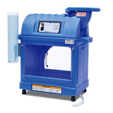 A blue, box-shaped device with an insulated cabinet, a transparent cylindrical holder on the left, a control panel and dial on the front, top-loading compartment, warning label below, and four black feet—features similar to the Sno-King Sno-Kone Machine.