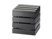 A small, square, black wooden box with four stacked layers and horizontal slats, resembling a miniature pallet crate or bamboo crate riser. The box is shown on a plain white background.