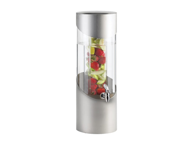 A tall, cylindrical beverage dispenser features an acrylic tank with a silver metallic base and lid. Inside, sliced green apples and whole strawberries are stacked in the central infusion chamber. A spigot is conveniently placed on the lower front.