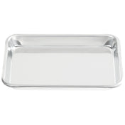 A shiny, empty rectangular sheet pan with raised edges is shown on a white background. Made of heavy duty aluminum, this 1/8 size tray is clean, reflective, and perfect for kitchens or serving food.