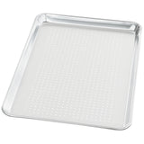 A rectangular, silver-colored aluminum sheet pan with perforated holes evenly distributed across its flat surface, and slightly raised, rounded edges on all sides. The tray appears clean and is set against a white background.