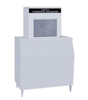 A large, high production ice machine with a rectangular metal body and vented top stands on four legs. The prominent front panel dispenses ice and is labeled Commercial Ice Machine, ideal for businesses needing a reliable Chunklet Ice Maker.