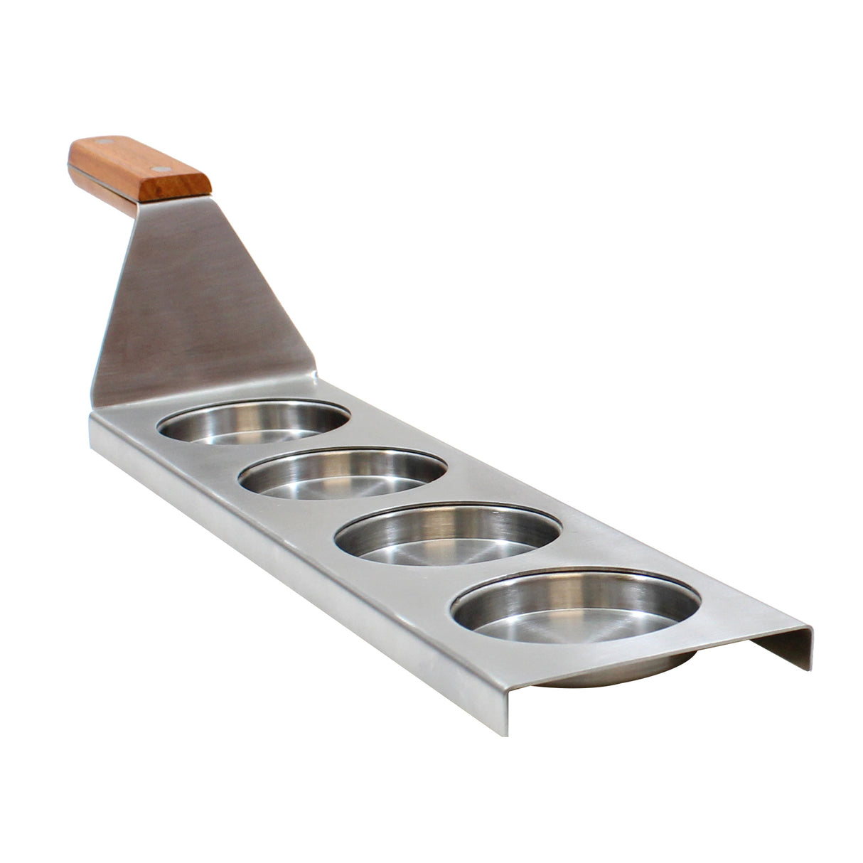 A TableCraft Products stainless steel egg ring tool with four round molds in a row and a flat metal handle topped with a wooden grip, designed for cooking multiple eggs or pancakes at once. The tool rests on a white background.