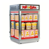A Gold Medal Products popcorn display warmer with an LED lighted sign sits filled with red, yellow, and white striped POP CORN boxes. Popcorn illustrations decorate the top, and the boxes are neatly arranged on the shelves.