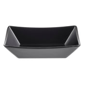 A rectangular, black ceramic bowl with angled sides and a glossy finish, photographed on a white background. Reminiscent of a Better Burger Fry Tray, it is empty and viewed from above, emphasizing its geometric shape and smooth surface.