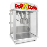 A Whiz Bang Popcorn Machine with a white top labeled POPCORN in bold red letters, decorated with cartoon kernels. This countertop popcorn machine features clear sides and a stainless steel kettle inside for popping corn.