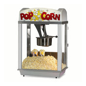 A Deluxe Whiz Bang Popcorn Machine filled with freshly popped popcorn. Two tubs are partially buried inside, with glass sides, a metal Unimaxx kettle, and a sign on top that says POP CORN alongside popcorn illustrations.