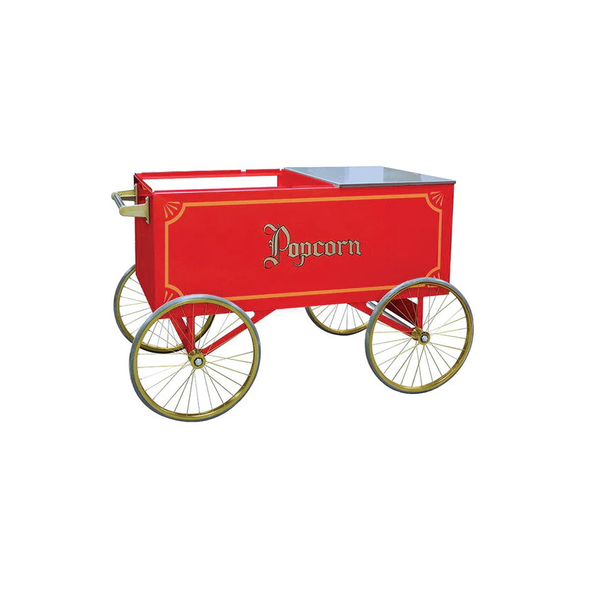 Red vintage-style popcorn cart by Gold Medal Products, featuring ornate gold "Popcorn" lettering, four large spoke wheels like a wagon, and a handle on one side. The cart has open compartments on top and is photographed against a white background.