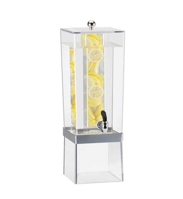 A tall, clear Econo Beverage Dispenser with a 3 gallon capacity is filled with water and stacked lemon slices. Featuring an infusion chamber and a silver spigot near the base, it sits atop a translucent stand against a plain white background.