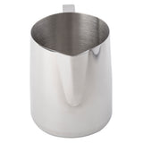 A stainless steel frothing cup with a 36 oz capacity, featuring a spout for pouring and a small handle at the back. Its brushed metallic finish shines against a white background, and the metal interior is empty.