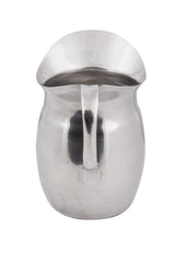 A shiny, metallic Bell Water Pitcher with a curved handle and wide, flared spout. The rounded stainless steel pitcher has a smooth surface that reflects light. It is dishwasher safe and isolated on a white background.