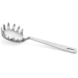 A polished stainless steel Pasta Grabber with a round, shallow bowl, evenly spaced prongs, and a center hole. The long, flat handle has a slot for hanging. This utensil is durable and dishwasher safe for easy cleaning.
