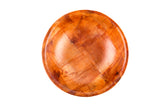 A round, empty mahogany wooden plate with a glossy finish and visible wood grain patterns, placed on a white background. The plate has a smooth surface and slightly raised edges.