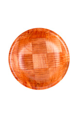A round wooden plate with a glossy finish, featuring a checkered pattern of alternating wood grain directions in warm mahogany tones. The plate is photographed from above on a plain white background, resembling an artisanal woven wood salad bowl.