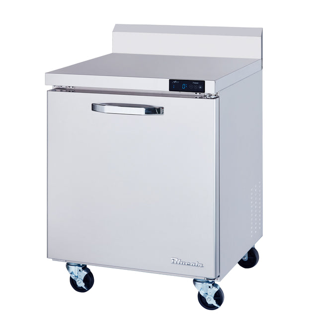 A stainless steel work top freezer with a single door, digital control panel, and sturdy handle. This 7.0 cu ft freezer features four black caster wheels for mobility, a backsplash on top, and the Dukers brand name on the lower right corner.