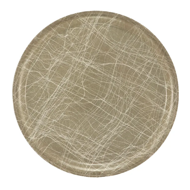 A round, tan fiberglass Serving Camtray features a textured pattern of intersecting white and beige scratch-like lines. This abstract design gives the plate a contemporary, artistic look. The tray is dishwasher safe and set against a plain, light background.