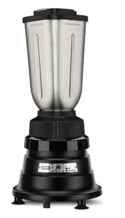 A bar blender with a stainless steel container and black base is shown. The large metal jar has a fitted lid, while simple control settings are on the rounded base. Rubber feet provide stability. The background is plain white, ideal for international use.