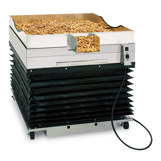 A commercial popcorn warmer with a stainless steel bin filled with popcorn on top, black accordion-style sides, control switches, and wheels for mobility features an adjustable height design, all set against a white background.
