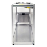 A tall, rectangular metal enclosure with clear sides and a flat metal base viewed from the end. Inside, a slanted metal shelf and round bowl suggest this is a Servalot chip warmer by Gold Medal Products, designed for efficient snack dispensing.