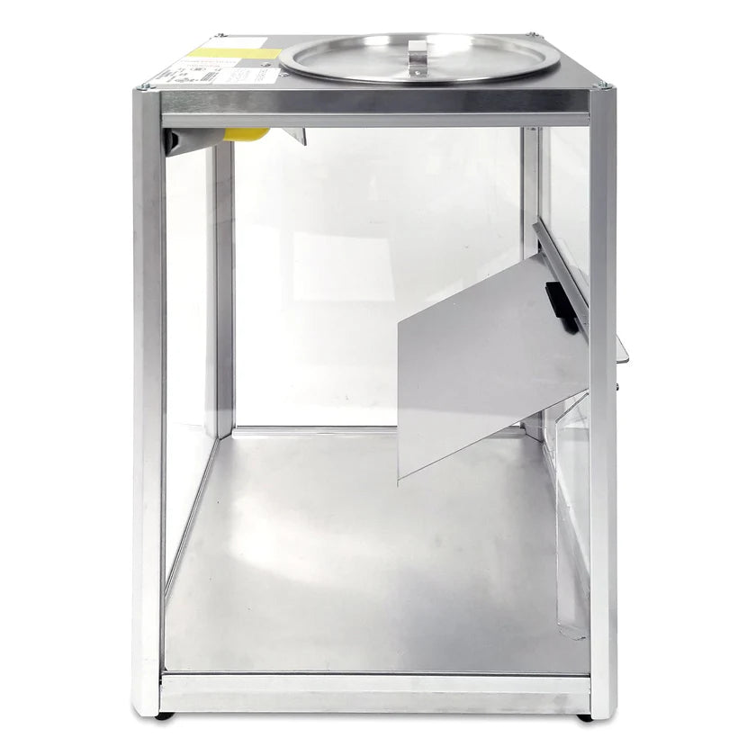 A rectangular, transparent ballot box with a metallic frame, reminiscent of a Gold Medal Products Servalot chip warmer. The top has a circular lid with a slit for ballots, and one side features a hinged, partially open panel. The empty box stands on a white background.