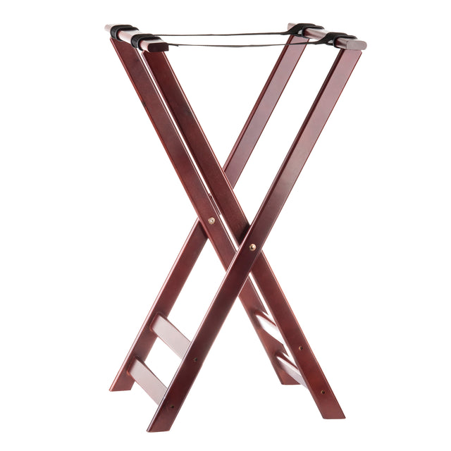 A dark wood tray stand with a rich mahogany finish, featuring crossed legs and slip-proof black nylon straps on top for holding suitcases. The rack is standing open on a white background.