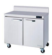 A commercial stainless steel two-section freezer with undercounter design, horizontal handles, digital control panel, backsplash, and four caster wheels. Its reflective work top freezer surface is ideal for any professional kitchen environment.