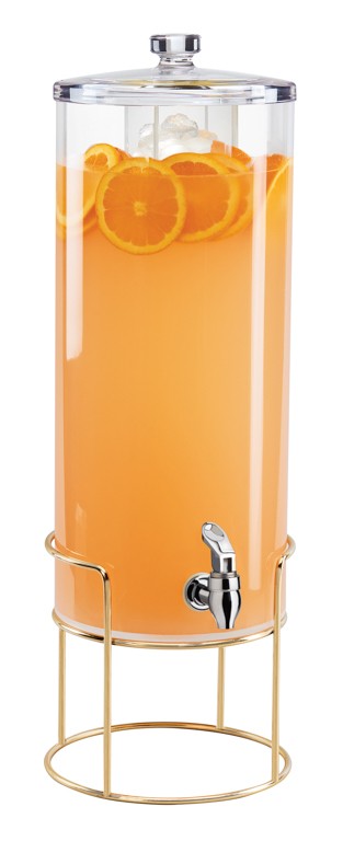 A tall, clear 3 gallon beverage dispenser filled with orange juice and orange slices stands on a gold metal frame, topped with a metal lid. It features a silver spigot near the base for easy pouring and stylish mid-century appeal.