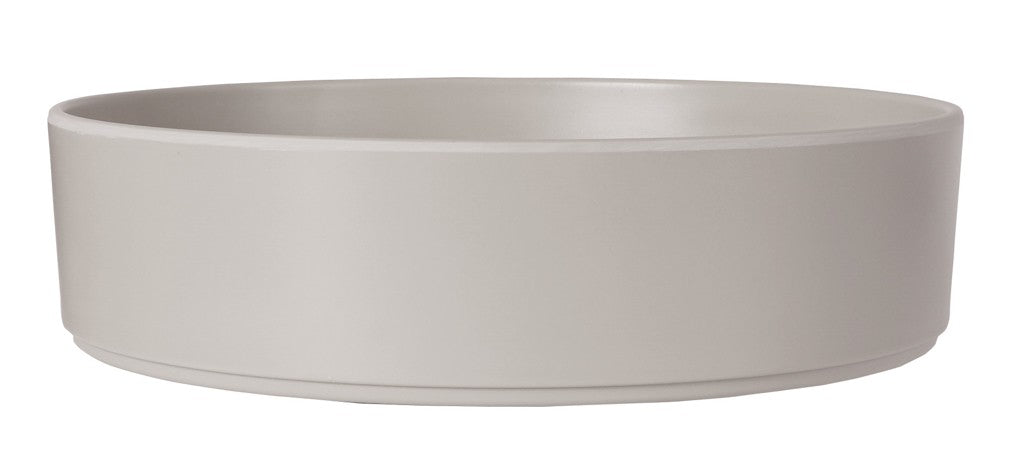 A plain, round 10" Ash Melamine Bowl with smooth sides and a matte light gray finish, viewed from the side against a white background. This simple, modern bowl is dishwasher safe and free of visible patterns or decorations.