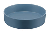 A round, shallow Stone Blue Melamine Bowl with smooth sides and no handles, this 10" bowl features a matte finish and minimalist design. Dishwasher safe and photographed against a white background, the tray is empty and modern.