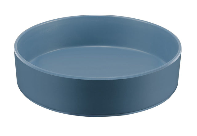 A round, shallow Stone Blue Melamine Bowl with smooth sides and no handles, this 10" bowl features a matte finish and minimalist design. Dishwasher safe and photographed against a white background, the tray is empty and modern.