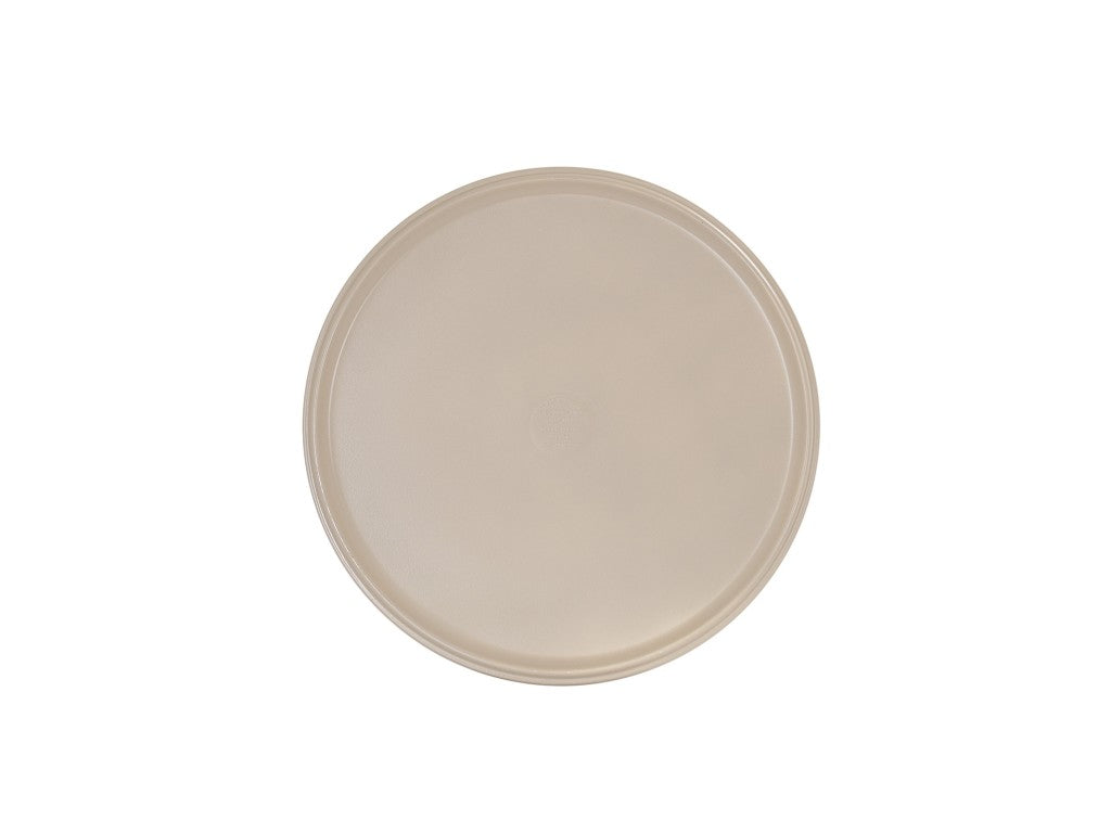 A plain, round, light beige Hudson Bowl tray with a slightly raised rim, viewed from above against a white background. The smooth surface has no visible patterns or designs, and the tray is dishwasher safe for easy cleaning.
