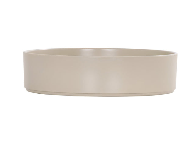 A plain, round, beige Hudson Bowl with straight, smooth sides and a flat base. The minimalist melamine bowl features a simple design, is dishwasher safe, and sits against a white background that highlights its neutral color and clean lines.