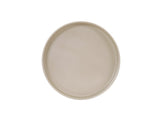 A round, light beige Hudson Bowl with a smooth, matte finish is viewed from above against a plain white background. The plate features a slightly raised rim, no visible patterns or decorations, and is dishwasher safe.