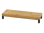 A rectangular Madera Riser with a natural wood grain finish, crafted from rustic pine and supported by four short black metal legs, photographed on a white background.