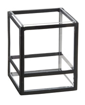 A black wireframe cube with open sides, showing a simple geometric design. This versatile piece can be used as a presentation display or countertop riser, with equal-length edges and square faces for visible depth and perspective.