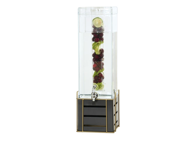The Empire Beverage Dispenser features a clear 3 gallon beverage dispenser with a spigot. Its infusion chamber holds sliced limes, cherries, and mint leaves, while the glossy black and gold grid base adds a modern, elegant touch.