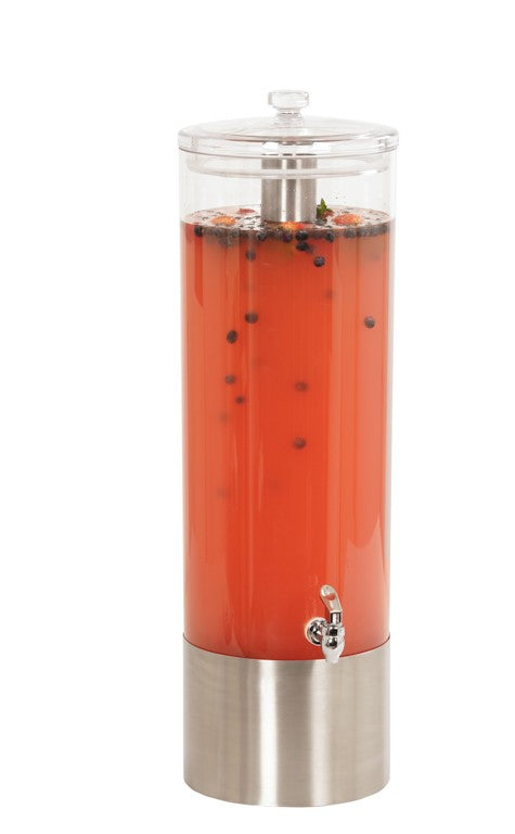 A tall, clear BPA free beverage dispenser with a stainless steel base and spigot is filled with bright orange liquid, herbs, and dark round berries. It features a transparent lid and sits against a white background.