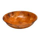 A round, shallow woven wood salad bowl with a smooth surface and checkered pattern of differently shaded wood pieces creates a patchwork appearance. The empty bowl is set against a white background.
