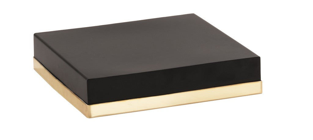 A closed, rectangular black box with smooth surfaces and a flat lid. The bottom edge is wrapped in a shiny, metallic gold band, giving it a modern, minimalist appearance—like a Monaco cube riser—set against a plain white background.