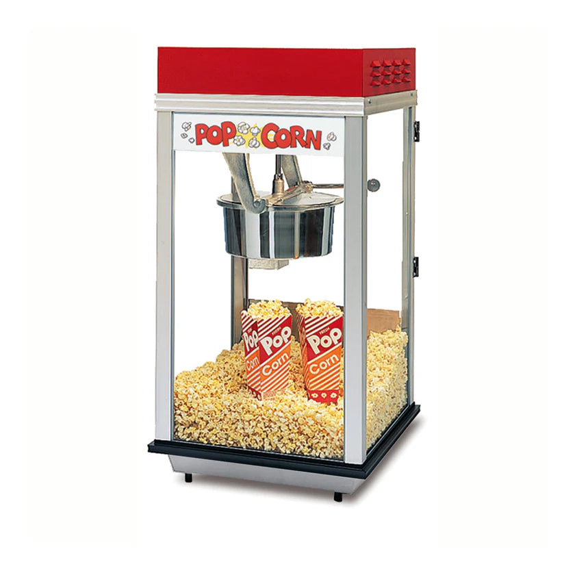A countertop popcorn machine with a red top and glass sides is filled with freshly popped popcorn. Inside, three red and white striped Pop Corn containers sit among the popcorn on the heated corn deck at the bottom.