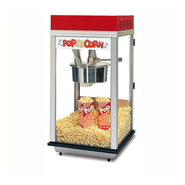 A countertop popcorn machine with a red top and glass sides is filled with freshly popped popcorn. Inside, three red and white striped Pop Corn containers sit among the popcorn on the heated corn deck at the bottom.