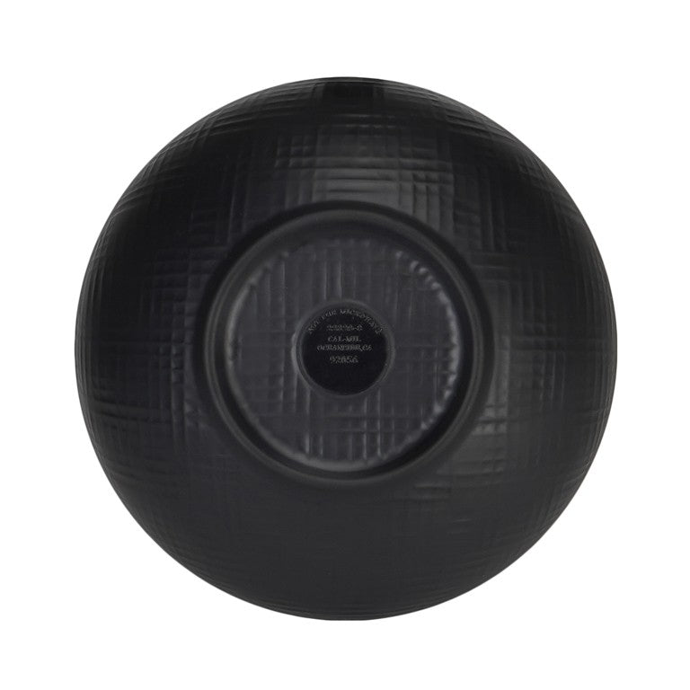 A black serving bowl, round and ceramic, viewed from above. The surface features a subtle crisscross texture, with a circular, slightly raised base at the center. Faint text inside the base indicates manufacturing details.
