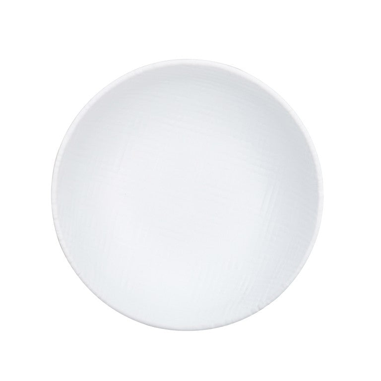 A plain, round, white ceramic plate is shown from above on a white background. The plate has a smooth surface with subtle crosshatch patterns and a slightly raised rim, echoing the minimal style of a white serving bowl.