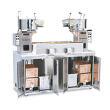 A Twin Maxi Popcorn Plant electric popcorn machine features two large popping kettles, digital controls, and a stainless steel base cabinet with open shelves below for oil and popcorn supplies. Popped corn fills the center bin, and wheels provide easy mobility.