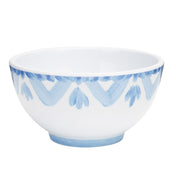 A 14 oz bowl in white ceramic with a blue hand-painted pattern near the rim, featuring zigzag lines and leaf-like shapes. The round shape, flared edge, and small circular base make it perfect for any setting. Background is plain white.