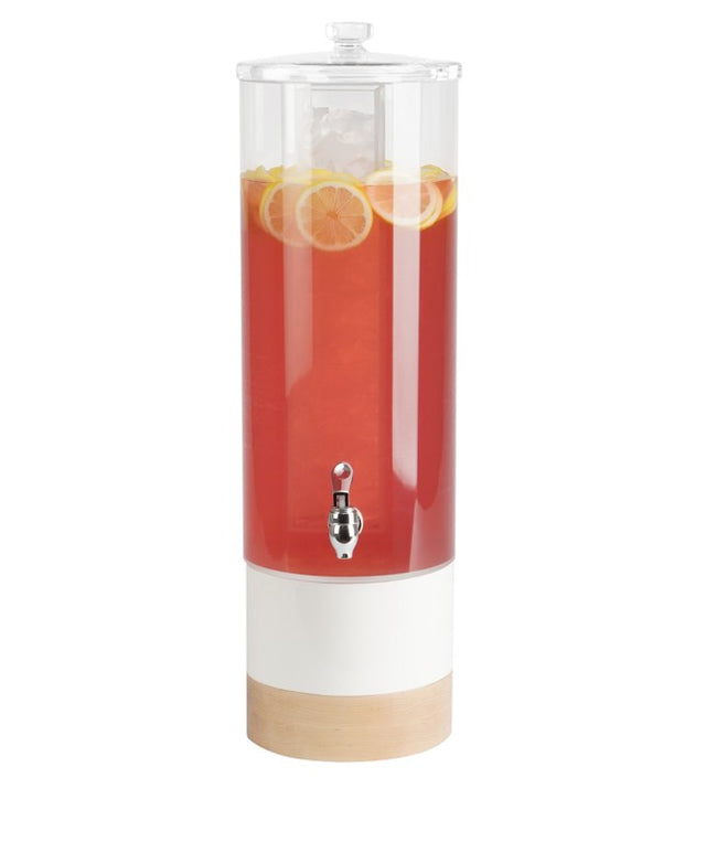 A tall, clear polycarbonate beverage dispenser filled with red drink, ice cubes, and lemon slices. It features a silver spigot, a transparent lid, a white midsection, and a light wood base against a plain white background.