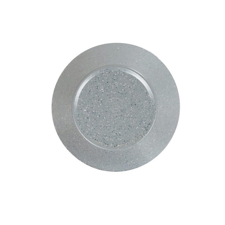 A round, clear glass plate seen from above, featuring a subtle pattern of small white and gray speckles reminiscent of a Coronado bowl. The background is completely white, highlighting the transparent and textured nature of the plate.