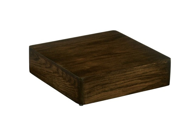 A dark wooden Heritage Riser by Cal-Mil features smooth edges and a flat top, set against a plain white background. The visible wood grain gives this square riser a polished, elegant appearance.